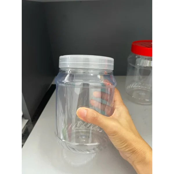 my-11134207-7r990-lntfv5sksosd64.webp Random Plastic Jar with Lid 1500ml L11cm W11cm H17cm